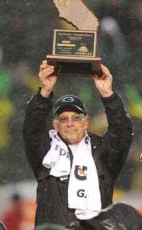 Granite Bay's Ernie Cooper raised a CIF state bowl game title trophy in the last game he coached for the school. Photo: Scott Kurtz.