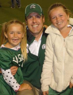 De La Salle head coach Justin Alumbaugh was happy to greet two nieces after his team won big game over Servite. Photo: Mark Tennis.