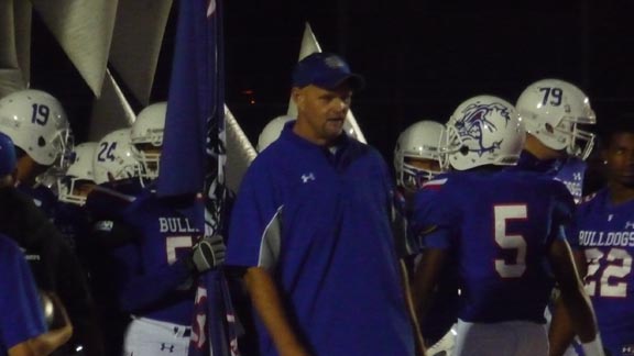 Co-head coach Kris Richardson shows some intensity before No. 5 Folsom took the field on Friday to play Granite Bay in its league opener. Photo: Mark Tennis.