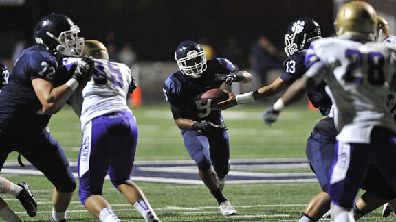 Loyola of Los Angeles senior running back David Cooper takes a handoff from junior quarterback Tre Polamalu during team's Friday night home game two weeks ago against St. Augustine. Photo: Ethan Ayson/LoyolaHS.edu.