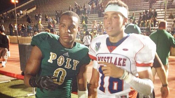 Malik Henry (right) may be playing for Long Beach Poly this season. He posed for photo after game last year with graduated Jackrabbit All-American Iman Marshall.  Photo: D1Bound.com (via Twitter).