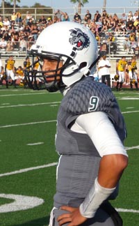 Helix QB Michael Austin gets told what play to run during team's game against Del Oro of Loomis. Photo: Mark Tennis.