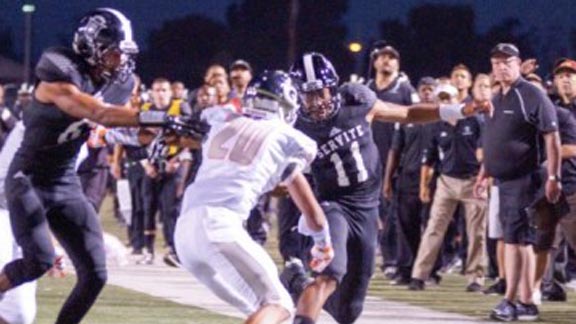 Servite of Anaheim QB Travis Waller looks for room on the sideline during game last Friday vs. Bishop Gorman. Photo: Patrick Takkinen/OC Sidelines. For more photos from this game, CLICK HERE.