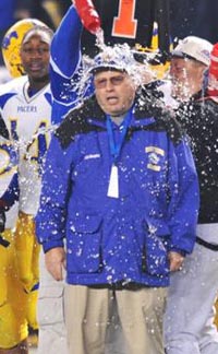 Grant head coach Mike Alberghini gets a bath after 2008 team beats Long Beach Poly. Photo: Scott Kurtz.