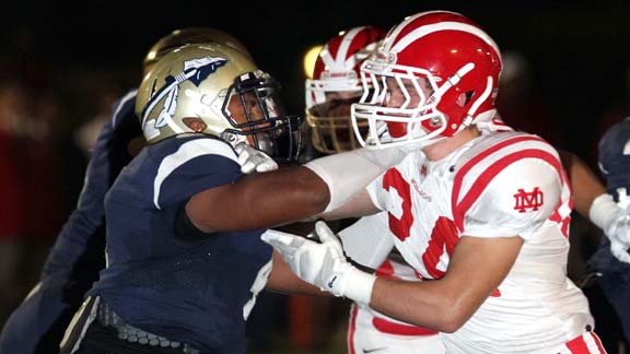 Players from St. John Bosco of Bellflower and Mater Dei of Santa Ana mix it up when those two top squads played on Oct. 10. Photo: Nick Koza/sportsamp.com