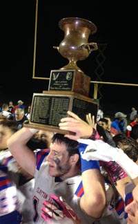Clayton Valley players take the Claycord Cup trophy for a walk after win over Concord. Photo: Paul Muyskens.