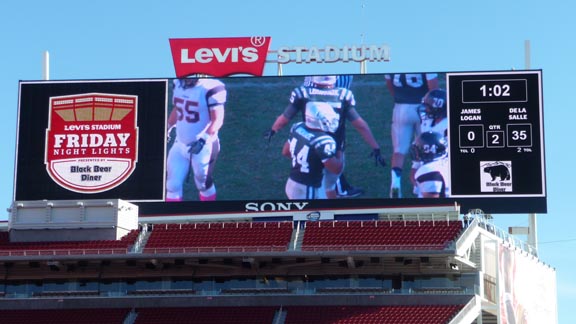 The Levi's Stadium scoreboard reflects De La Salle's dominance just before halftime of its game against James Logan of Union City. Photo: Mark Tennis.