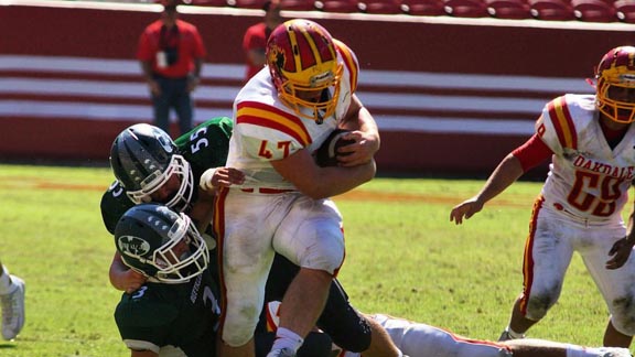 Oakdale senior Frankie Trent is about to break loose from a pair of Manteca tacklers and score one of his six TDs during Saturday game at Levi's Stadium. Photo: Phillip Walton/SportStars.