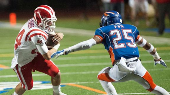 Mater Dei's Garrett Estrada makes a move against Westlake's Daniel Fox during the two teams' battle last week in Westlake Village. Photo: Miguel Vasconcellos/OCSidelines. For more OCSidelines photos, CLICK HERE.