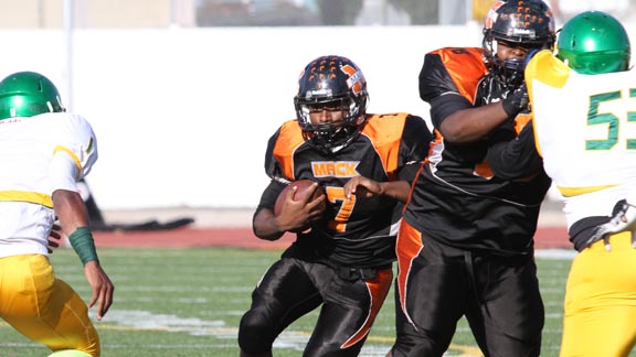 McClymonds of Oakland running back Lavance Warren tries to sneak through a hole during game last Friday against Fremont of Oakland. Photo: Willie Eashman.