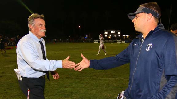 Who will be happier when Mater Dei head coach Bruce Rollinson (left) shakes hands with St. John Bosco's Jason Negro after this Friday's game? Rollo looks happier in this photo after team lost in 2014 to Braves. Photo: Nick Koza/sportsamp.com