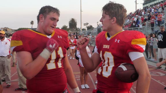 Cathedral Catholic's Jacob Van de Grift (left) and Clayton Dale exchange fist bump shortly after the Dons defeated Oaks Christian of Westlake Village. Photo: Mark Tennis.