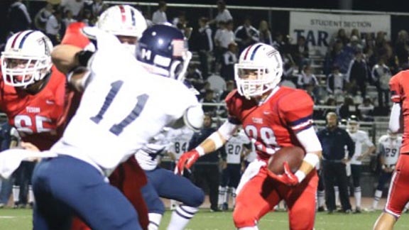 Tesoro running back Anthony Battista looks for room behind strong blocking during team's win vs. Newport Harbor. Photo: LeAnne Buoncristiani/OCSidelines.com.