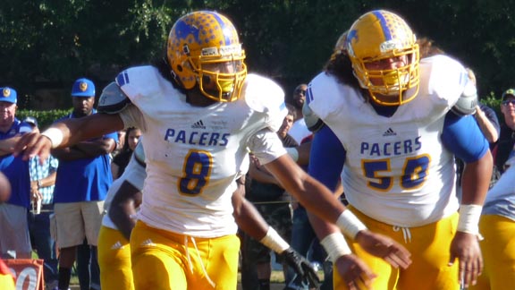 David Moala (8) and 306-pound sophomore Orlando Umana (50) are clearing the way for Sacramento Grant RB DeShawn Collins in team's big win vs. Jesuit. Photo: Mark Tennis.