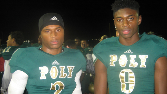 Long Beach Poly's Jeremy Calhoun (left) scored the game-winning 10-yard touchdown run and defensive back Colin Samuel blocked two kicks and batted down a couple of passes in the Jackrabbits' 34-33 CIFSS Pac-5 Division first-round playoff victory over Servite of Anaheim. Photo: Ronnie Flores.