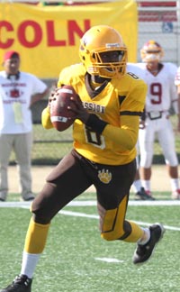 Jerrel Stancil made plays with his feet and his arm in Mission's Turkey Day win over Lincoln. Photo: Willie Eashman.
