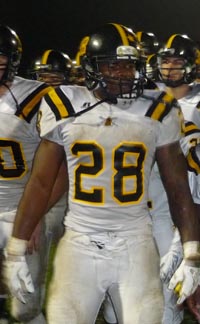 Rio Linda running back Marcel Brown leads team in victory song after Friday triumph in Manteca. Photo: Mark Tennis.