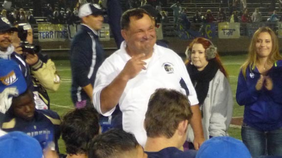 Central Catholic head coach Roger Canepa speaks to his team after 42-35 victory on Friday night over Sonora in CIF Sac-Joaquin Section Division IV championship. Photo: Mark Tennis.