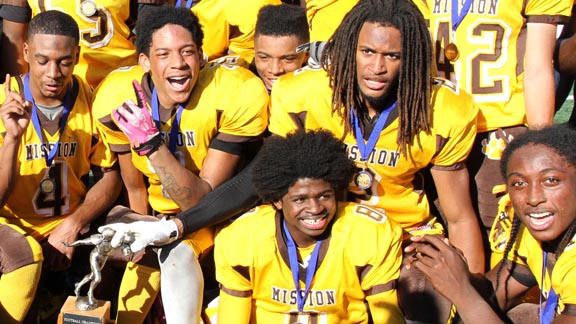 Players from Mission of San Francisco pose with championship trophy after their team defeated Lincoln 36-12 in annual San Francisco Turkey Day contest. Photo: Willie Eashman.