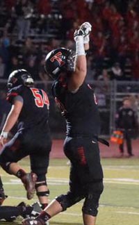 San Clemente's Sam Darnold has just scored on a 1-yard run that tied game at 21-21 vs. Capistrano Valley. The Tritons went on to win in overtime. Photo: Patrick Takkinen/OCSidelines.com.