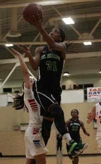 St. Mary's frosh Aquira DeCosta tries twisting layup vs. St. Ignatius in Platinum Division final. Photo: Jonathan Hawthorne/SportStars.