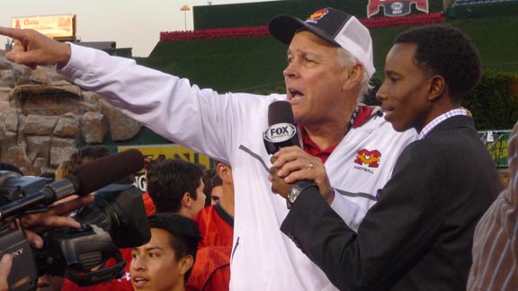 Mission Viejo head coach Bob Johnson acknowledges the school's fans at the podium after team won CIF Southern Section West Valley Division title. Photo: Mark Tennis.
