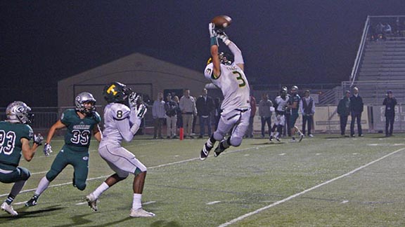 Tracy DB Jacob Alvarado goes up to make leaping interception in team's section semifinal win against Granite Bay. Photo: Wayne Thallander/TracyHighFootball.com.