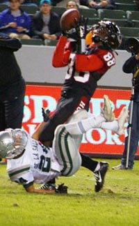 Javon McKinley makes one of his two TD catches for Corona Centennial against De La Salle. He also scored on a 92-yard kickoff return. Photo: Phillip Walton/SportStars.