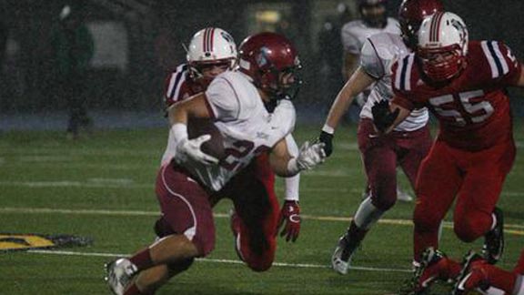 Senior Oscar Gomez from St. Margaret's of SJ Capistrano looks for room to run vs. Christian of El Cajon in CIF D4 South bowl game. Photo: Patrick Takkinen/OCSidelines.com.