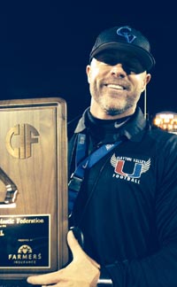 Clayton Valley's Tim Murphy holds NorCal D2 title plaque after win last Saturday over Oakdale. Photo: Harold Abend.