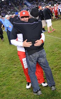 The only father-son State Coaches of the Year get in a hug after CIF Division II state bowl game. Photo: Twitter.com.