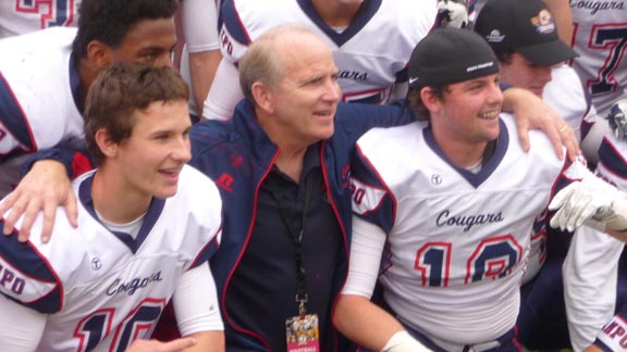 Head coach Kevin Macy of Moraga Campolindo poses with some of his players after team capped 16-0 season with CIF D3 state crown. The Cougars lost in CIF D3AA state final last year to La Mirada. Photo: Mark Tennis.