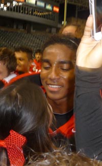 Malik Lovette of Redlands East Valley collects a hug from a cheerleader after team won CIF Division II state bowl game. Photo: Mark Tennis.