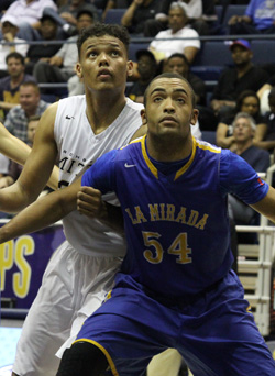 Ben Kone and Kendall Lauderdale battled it out underneath the basket throughout the D2 title game. Photo: Willie Eashman.