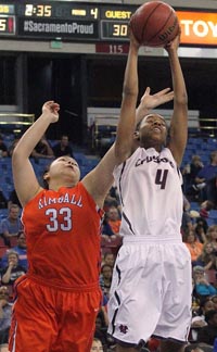 Lexia Bell-White of Modesto Christian grabs rebound in CIF Sac-Joaquin Section D2 final against previously unbeaten Kimball of Tracy. Photo: Glenn Moore/Tracy Press.