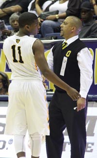 Bishop O'Dowd head coach Lou Ritchie gives instructions to guard Austin Walker. Photo: Willie Eashman