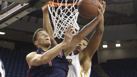 Christian Ellis of Modesto Christian goes for a reverse layup during CIF NorCal Open Division final and is met near the rim by O'Dowd's Ivan Rabb. Photo: Willie Eashman.