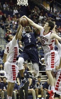 Sean Gilmore (23) of S.F. University applies the block against Sierra Canyon's Remy Martin. Photo: Willie Eashman.