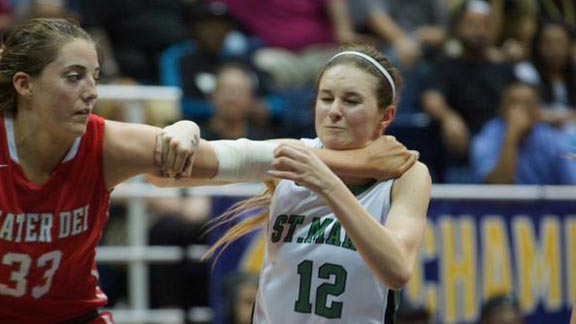 It can get physical in a CIF state final as shown above with Mater Dei's Katie Lou Samuelson battling with Kat Tudor of Stockton St. Mary's. Photo: Phillip Walton/SportStars.