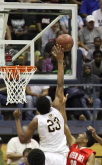 Ivan Rabb of Bishop O'Dowd goes well above the rim to get to a shot by K.J. Smith of Mater Dei during 2015 CIF Open Division state final. Photo: Willie Eashman.