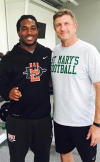 Former player Na'im McGee stands with Stockton St. Mary's head coach Tony Franks. Photo: @SMRamsFB.