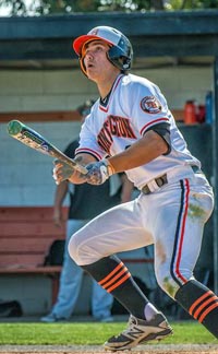 Huntington Beach's Landon Silver watches flight of home run during CIFSS playoff game. Photo: Terry Jack/OCSidelines.com.