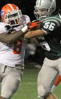 Players from Bishop Gorman of Las Vegas and De La Salle battle it out in the trenches in 2010 matchup. Photo: Willie Eashman.