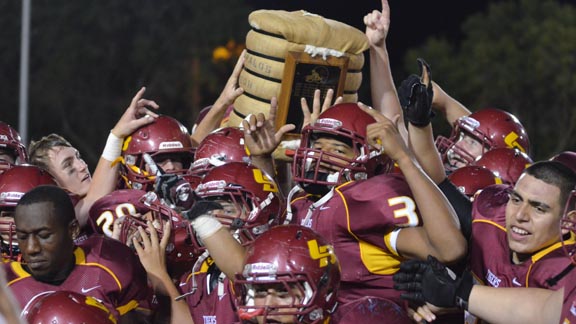 Los Banos players celebrate after recent win over Dos Palos in a rivalry between schools from different CIF sections dubbed the Westside War that dates to first season in 1925. Photo: lbsportsboosters.com.