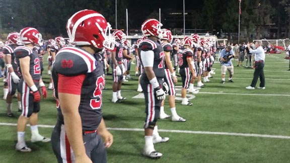 Mater Dei head coach Bruce Rollinson leads team in hut drill after big win on Friday over Bishop Amat of La Puente at Santa Ana Bowl. Photo: Carlos Arias/OCSidelines.com.