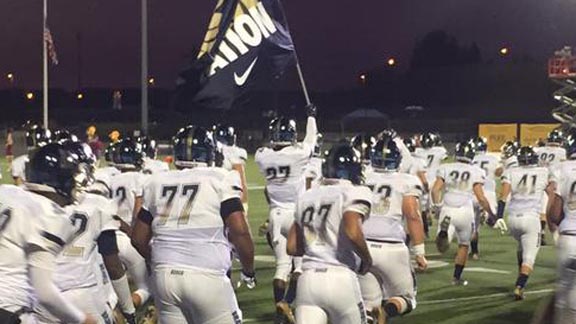 St. John Bosco players hit the field in Portland (Ore.) on Friday night for game shown on ESPNU against Central Catholic of Portland. Braves won 66-17. Photo: @boscofootball (Twitter.com).