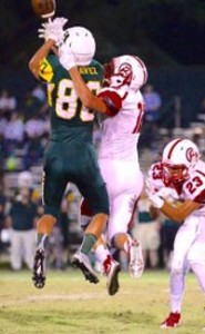 Alex Chavez of Hilmar goes up to catch a pass in game with Ripon that produced three State Stat Stars. Photo: ZariagPhotography via BlackHatFootball.com.