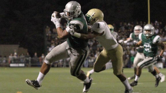 Two-way standout Devin Asiasi is about score to his second touchdown during De La Salle's 52-6 victory over Long Beach Poly on Friday. Photo: Willie Eashman.