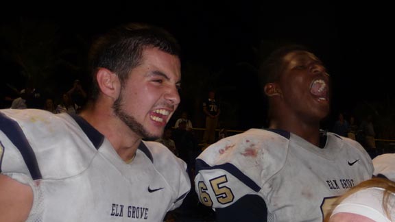 Junior Jake Bellecci and senior Jacob Cornelio whoop it up while standing on a bench after Elk Grove's big win on Friday night over Grant of Sacramento. Photo: Mark Tennis.