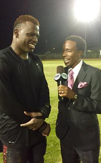 Serra's Oluwale Betiku chats with Rahshaun Haylock of FoxSports1 in Los Angeles after he had five sacks in win vs. Alemany. Photo: @serrasports via Twitter.com.